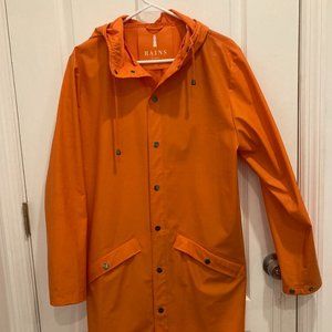 The RAINS Long Jacket in Fire Orange